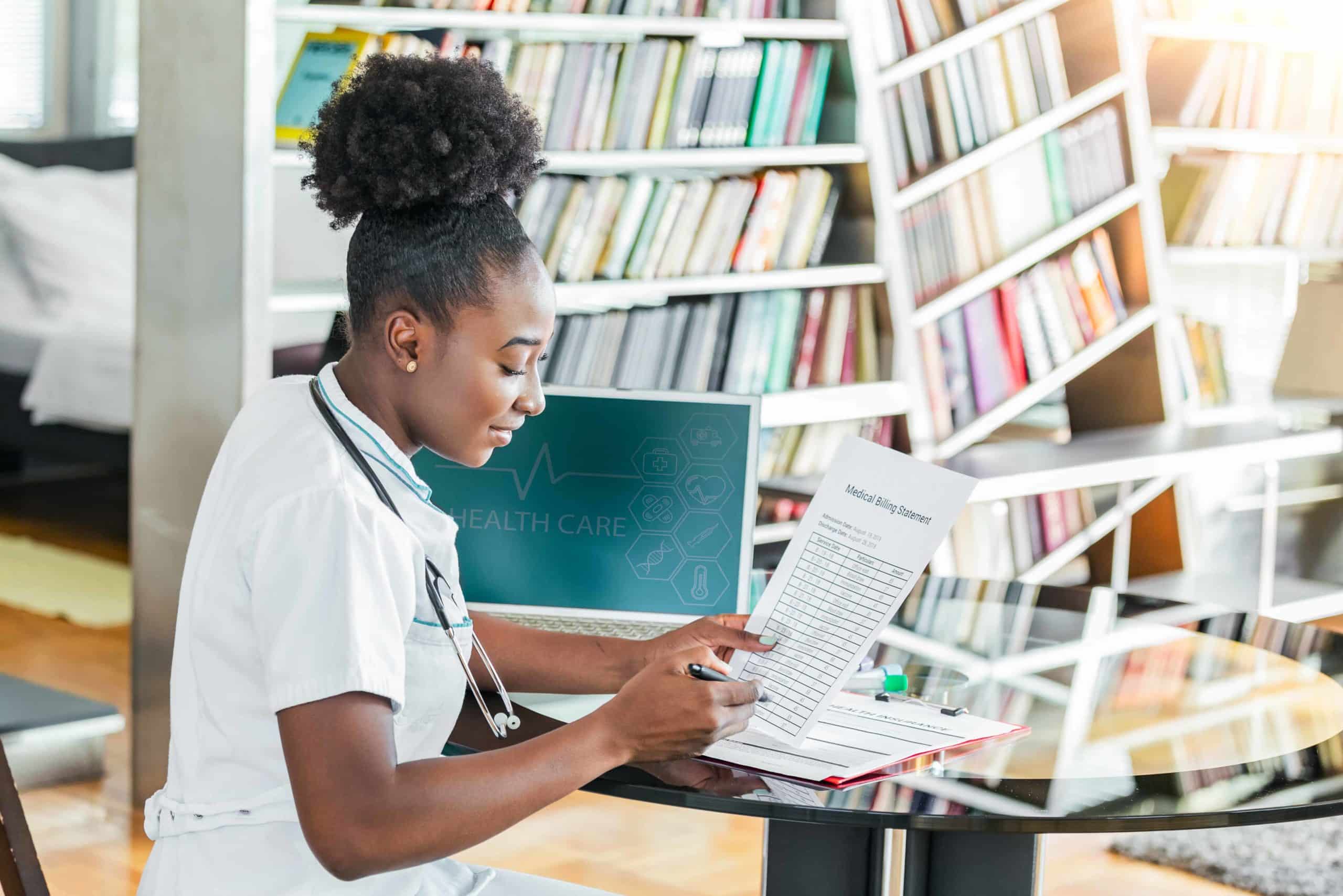 A medical professional reviews a medical bill to ensure payment integrity