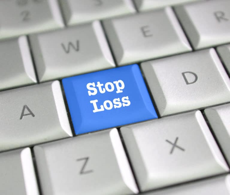 A “Stop Loss” button on a keyboard visualizes stop-loss insurance examples.